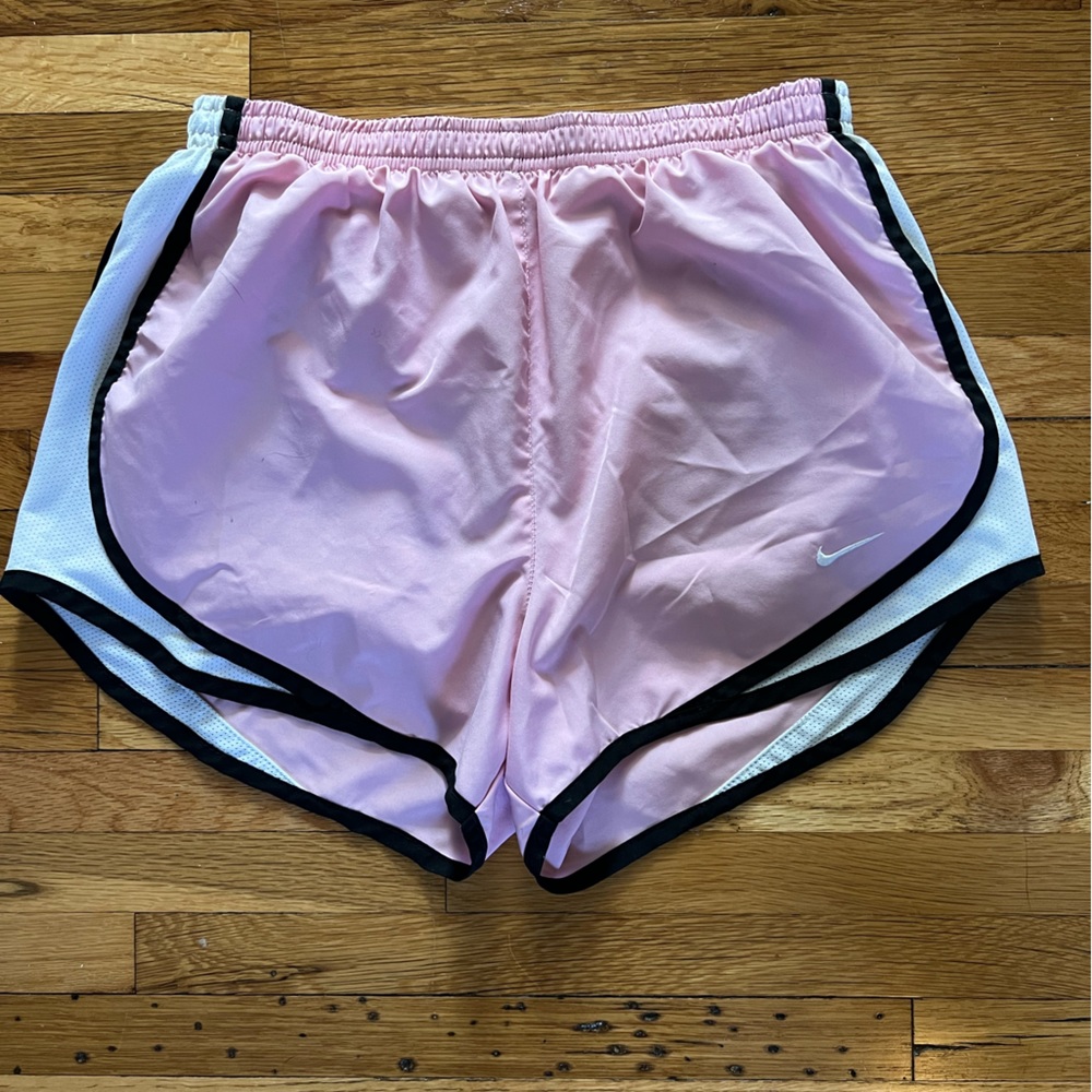 Nike light pink dry fit running shorts.